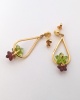 Boucles d'oreilles péridot et grenats fleurs or jaune 750