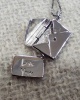 Pendant in the shape of an envelope with a letter inside Love You